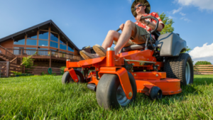 man  using lawn mower that he borrowed from a friend